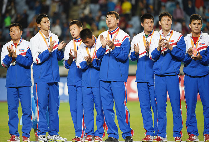 Silver medalists North Korea is seen on the podium during the medal ceremony following the Football Men's Gold Medal match on Thursday.