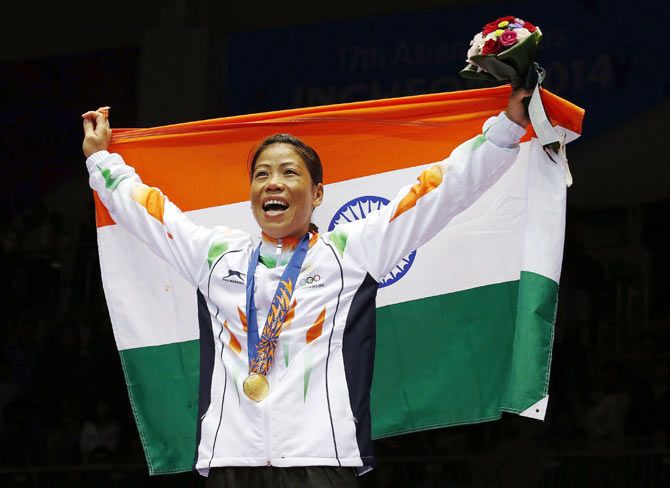 India's gold medallist MC Mary Kom reacts during the medal ceremony for the women's fly (48-51kg) boxing competition at the Seonhak Gymnasium during the 17th Asian Games in Incheon on Wednesday. 