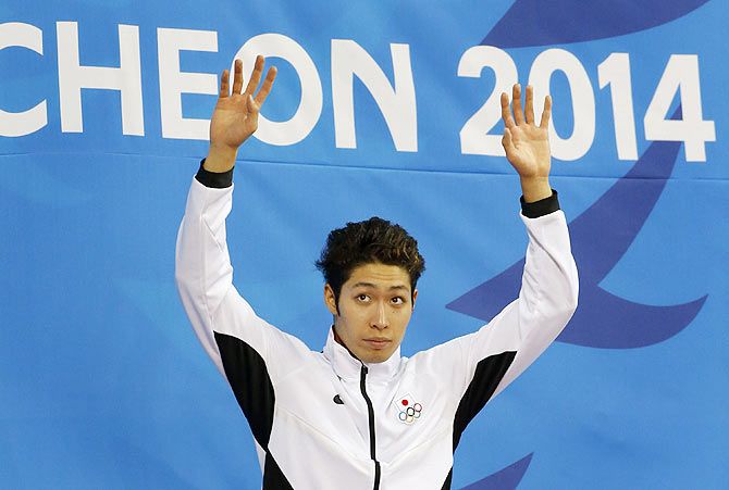 Gold medalist Kosuke Hagino of Japan celebrates during the victory ceremony for the men's 400m individual medley final