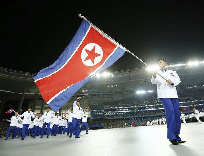 Flag bearer of North Korea Sok Yongbom leads the team into the Opening Ceremony of the 17th Asian Games in Incheon September 19, 2014