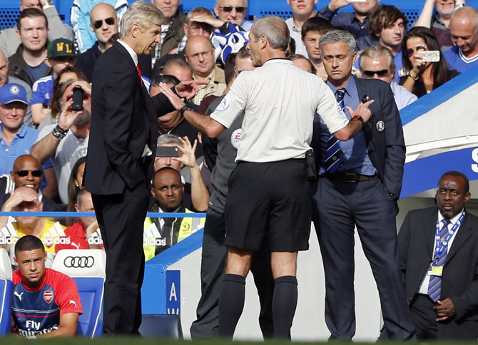 Chelsea manager Jose Mourinho (right) and his Arsenal counterpart Arsene Wenger