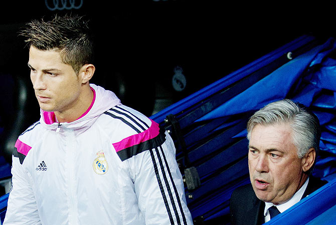 Cristiano Ronaldo (left) of Real Madrid with head coach Carlo Ancelotti 