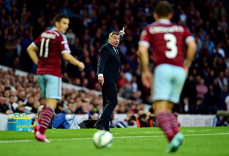 Sam Allardyce the West Ham manager signals to his players during the English Premier League match against Queens Park Rangers at Boleyn Ground in London on Sunday