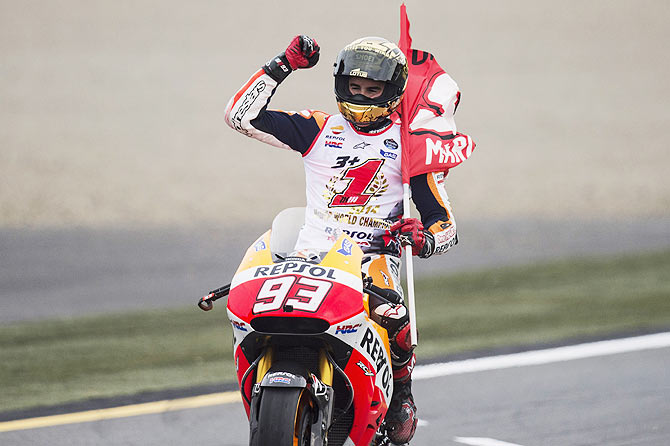 Marc Marquez of Spain and Repsol Honda Team celebrates winning the 2014 MotoGP championship at the end of the MotoGP race during the MotoGP Of Japan