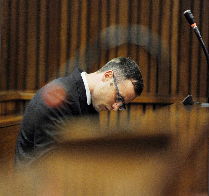 Oscar Pistorius sits in the Pretoria High Court for sentencing in his murder trial on Monday