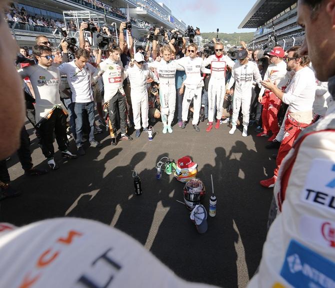 Formula One drivers pray