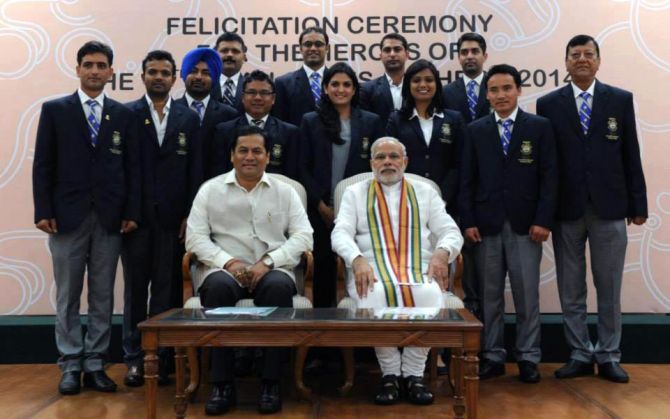 Prime Minister Narendra Modi and Sports Minister Sarbananda Sonowal with India's medal- winning shooters 
