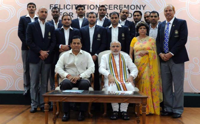Prime Minister Narendra Modi and Sports Minister Sarbananda Sonowal with the gold medal winning kabaddi team 
