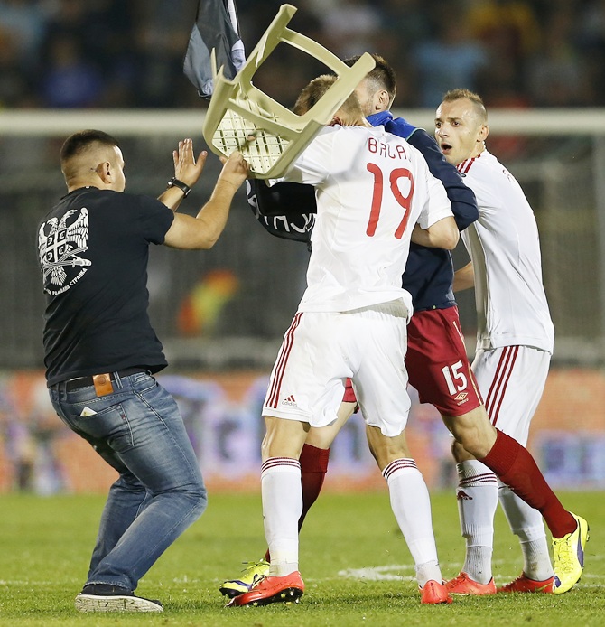 Fans and players of Serbia and Albania clash