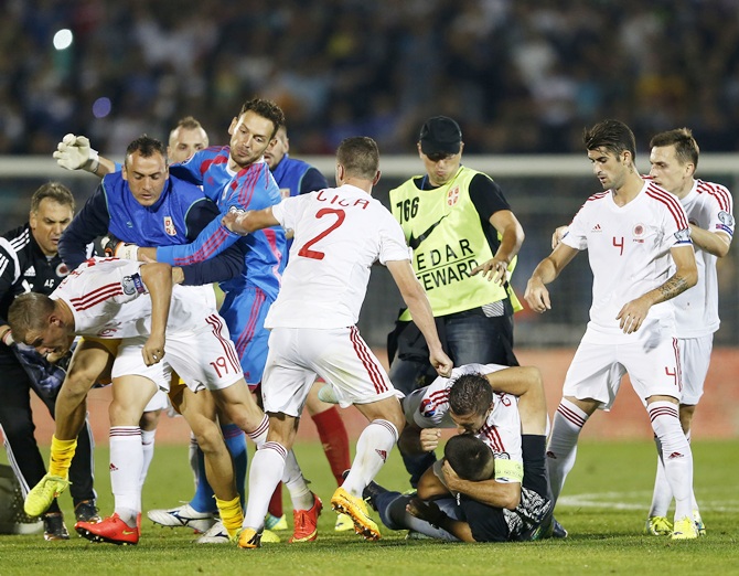 Fans and players of Serbia and Albania clash