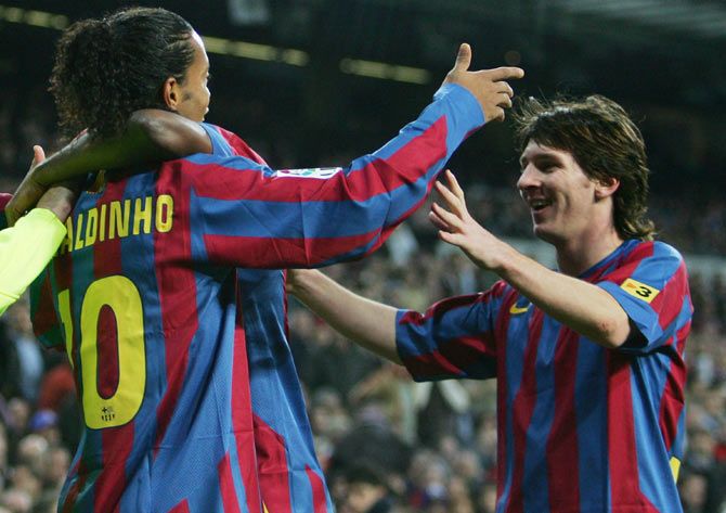 Ronaldinho (left) of Barcelona celebrates with Lionel Messi