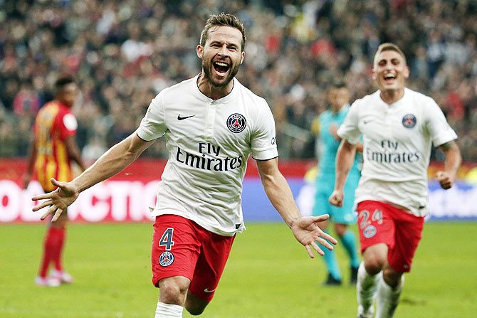 Paris St Germain's Yohan Cabaye (left) celebrates after scoring the first goal for his team during their French Ligue 1 match against RC Lens at the Stade de France in Saint-Denis near Paris on Friday