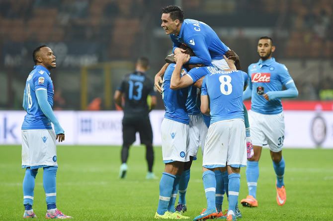 Jose Maria Callejon of SSC Napoli celebrates with teammates after scoring his second goal  during their Serie A match against Inter Milan at Stadio Giuseppe Meazza in Milan on Sunday