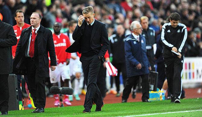 Swansea manager Garry Monk leaves the pitch after the Barclays Premier League match between Stoke City and Swansea City at Britannia Stadium on Sunday