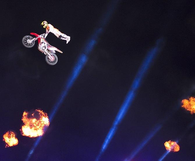 A rider performs motorcycle stunts 