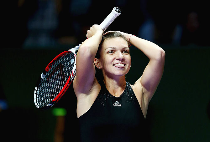 Simona Halep of Romania celebrates her straight sets victory over Serena Williams 