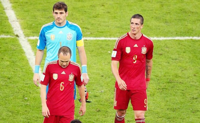 Andres Iniesta,Iker Casillas and Fernando Torres of Spain walk off the pitch