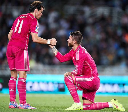 Gareth Bale of Real Madrid CF helps to his teammate Sergio Ramos