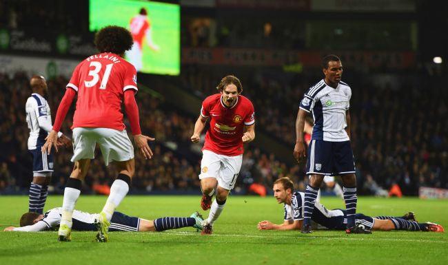 Daley Blind of Manchester United (17) celebrates with Marouane Fellaini after scoring