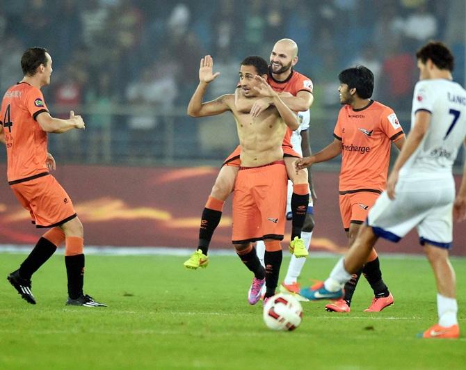 Delhi Dynamos' Gustavo M Dos Santos celebrates