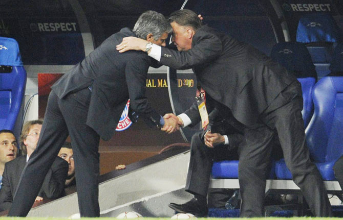 Jose Mourinho (left) shakes hands with Louis van Gaal 