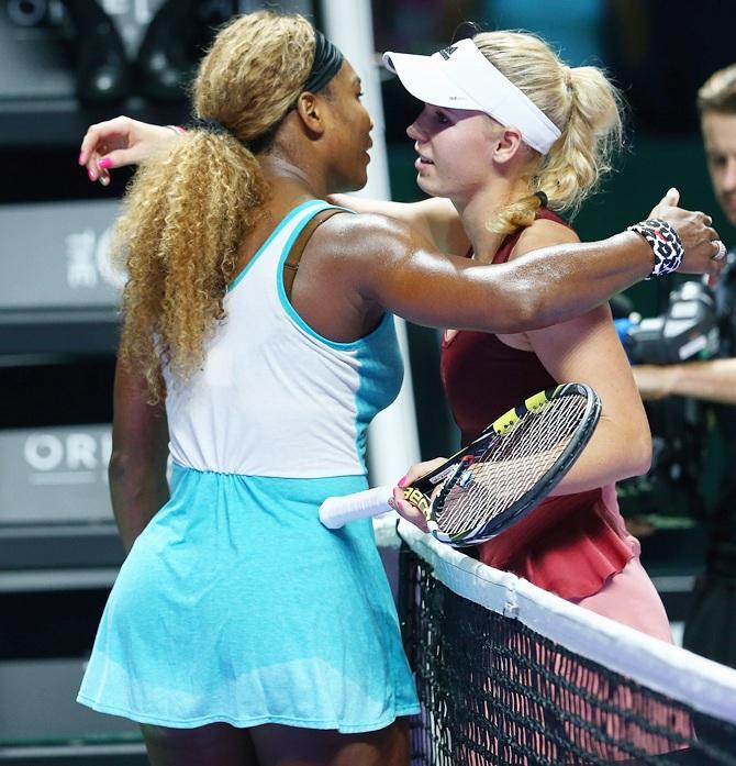 Serena Williams of the United States at the net after her three set victory against Caroline Wozniacki