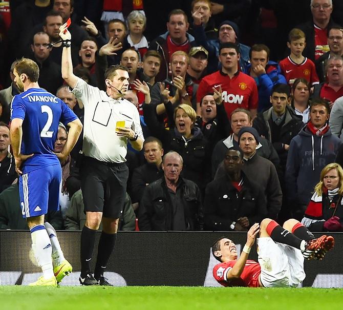 Referee Phil Dowd shows a red card to Branislav Ivanovic