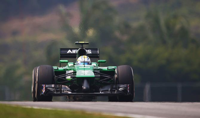 Marcus Ericcson of Sweden and Caterham of Great Britain and Marussia drives during practice for the Malaysia Formula One Grand Prix