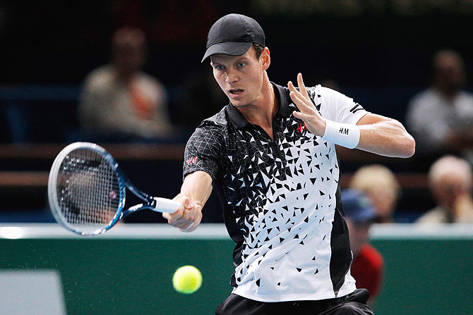 Tomas Berdych of Czech Republic plays a forehand against Adrian Mannarino of France during their match at the Paris Masters on Tuesday