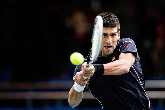 Novak Djokovic of Serbia in action against Philipp Kohlschreiber of Germany during their second round match at the Paris Masters at Palais Omnisports de Bercy on Tuesday