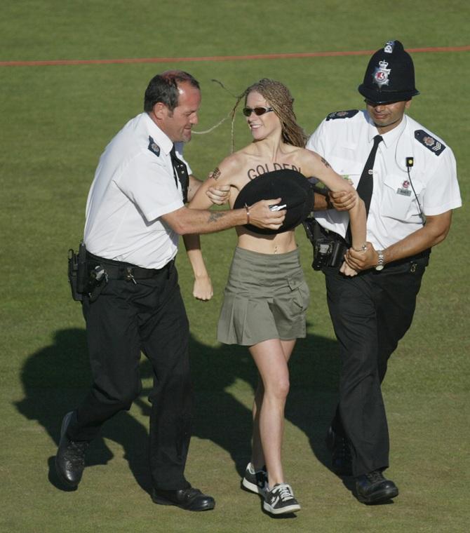 Police remove a streaker 