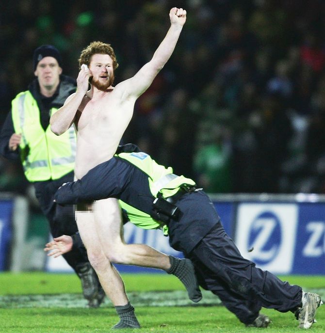 A pitch invader evades police