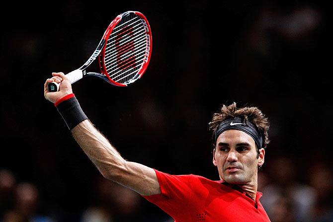 Roger Federer  of Switzerland in action against Lucas Pouille of France during day 4 of the BNP Paribas Masters