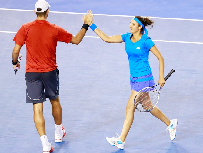 Sania Mirza of India and Bruno Soares of Brazil celebrate 