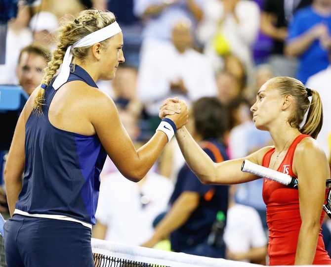 Victoria Azarenka of Belarus meets Aleksandra Krunic of Serbia after defeating her