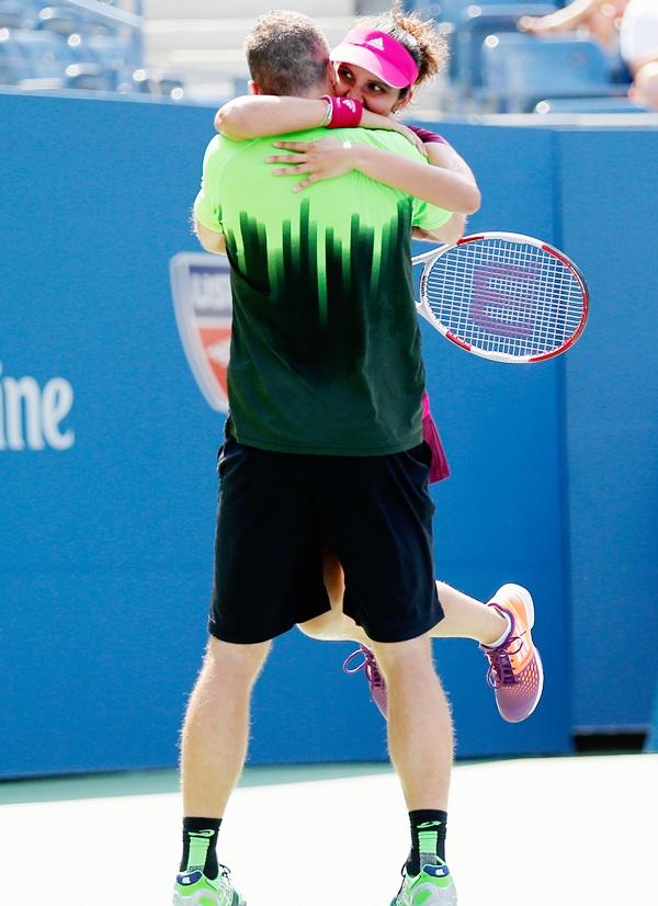 Sania Mirza, right, of India and Bruno Soares of Brazil celebrate