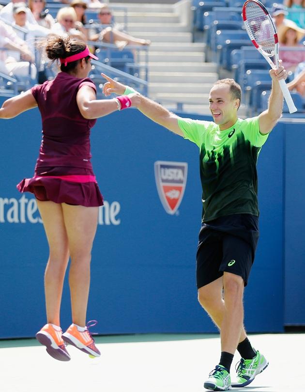 Sania Mirza, left, of India and Bruno Soares of Brazil celebrate