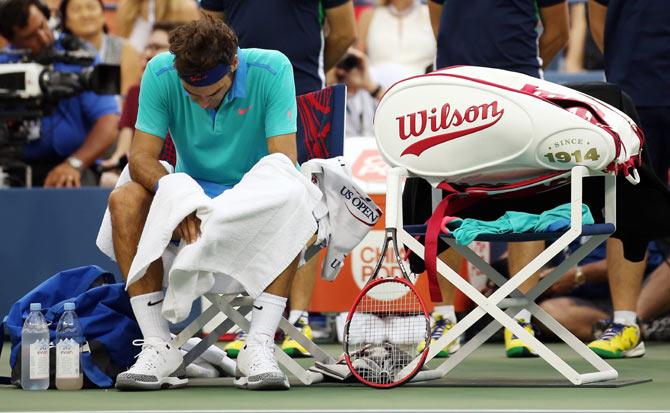 Roger Federer of Switzerland looks on against Marin Cilic of Croatia during their men's singles semifinal match on Saturday