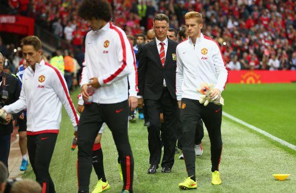 Louis Van Gaal walks out during half-time