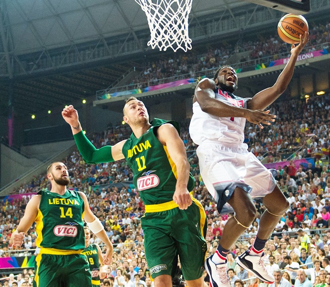 Kenneth Faried of the USA BasketballMen's National Team shoots against Lithuania's Donatas Motiejunas