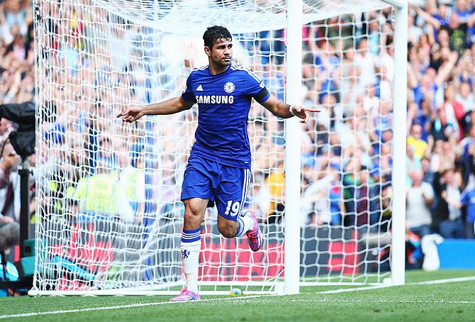 Diego Costa celebrates after scoring against Swansea