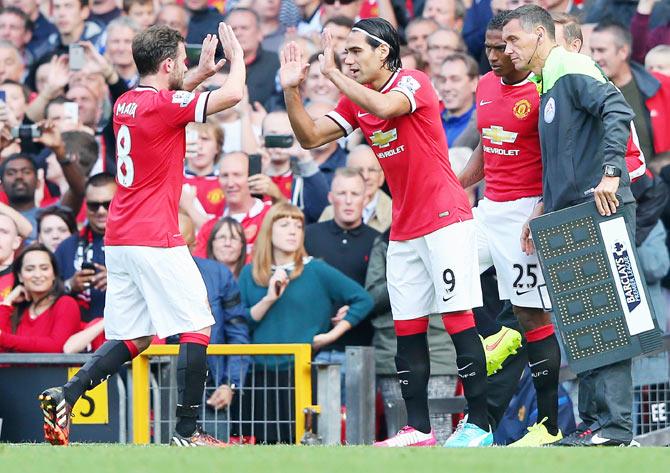 Radamel Falcao of Manchester United comes on as a substitute for Juan Mata to make his debut in their EPL match against Queens Park Rangers at Old Trafford on Sunday