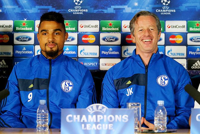 Kevin-Prince Boateng and Jens Keller of FC Schalke talk to the media