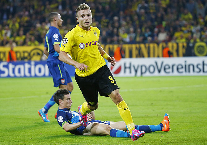 Borussia Dortmund's Ciro Immobile reacts after scoring past Arsenal's Laurent Koscielny during their Champions League group D match on Tuesday