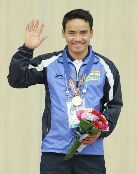 Gold Medalist Rai Jitu of India celebrates on the podium after winning his gold medal in the 50m Pistol Men's event at Ongnyeon International Shooting Range 