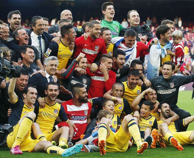 Atletico Madrid players celebrate after winning the Spanish first division title