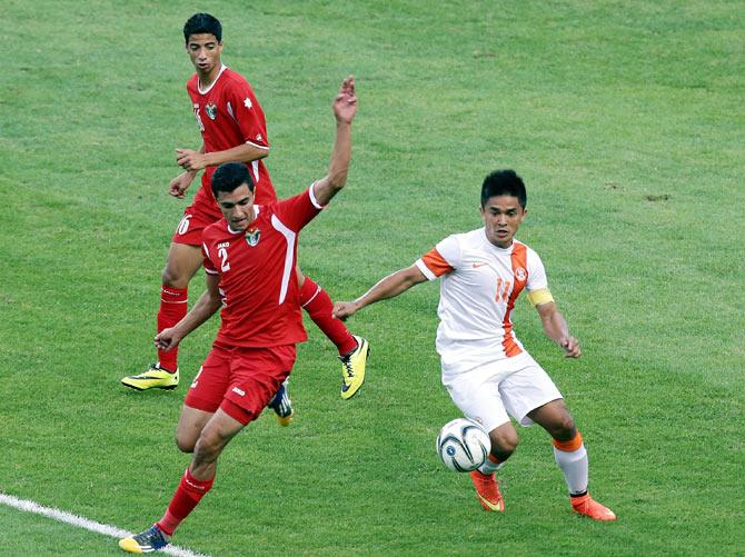 Omar Ahmad Mustafa Almannasrah of Jordan battles with Sunil Chhetri of India during their match on Monday.