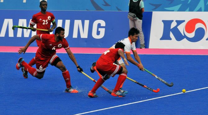 Action in the Asian Games match between India and Oman.