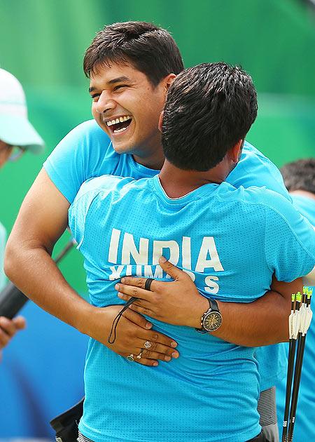 Sandeep Kumar and Abhishek Verma of India celebrate 