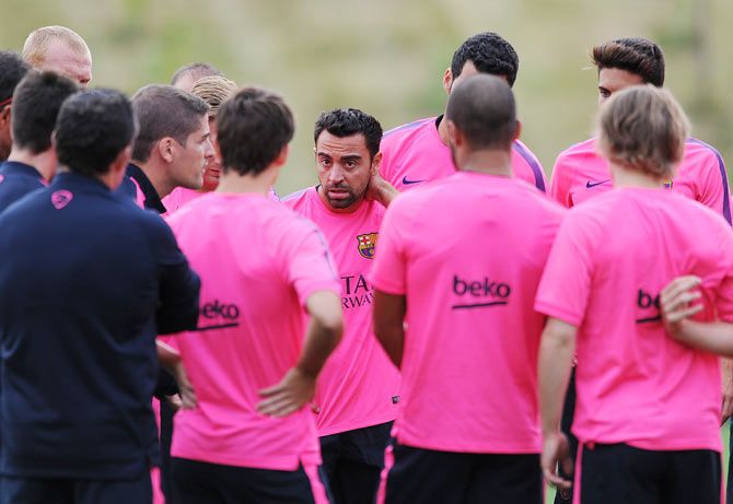Xavi of Barcelona looks on during the Barcelona Training Session at St George's Park